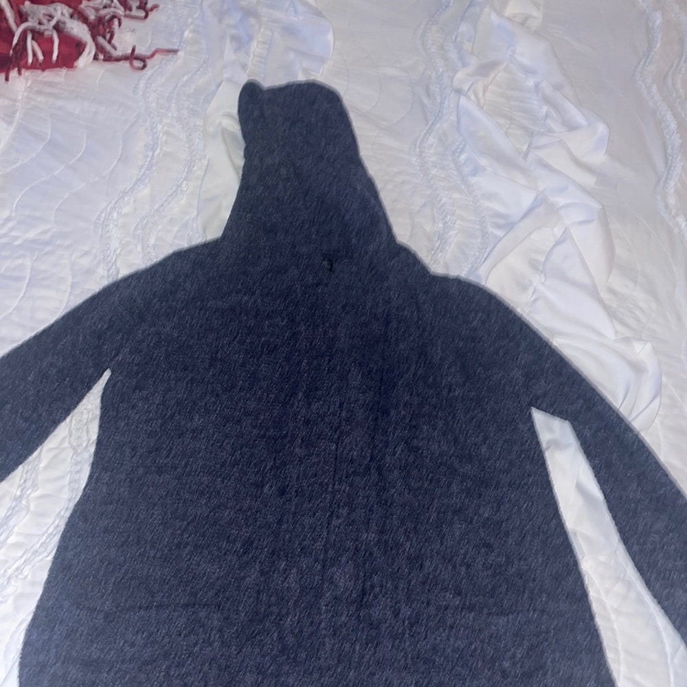 Hooded Barefoot Dreams dark gray cardigan with pockets and slits on both sides.